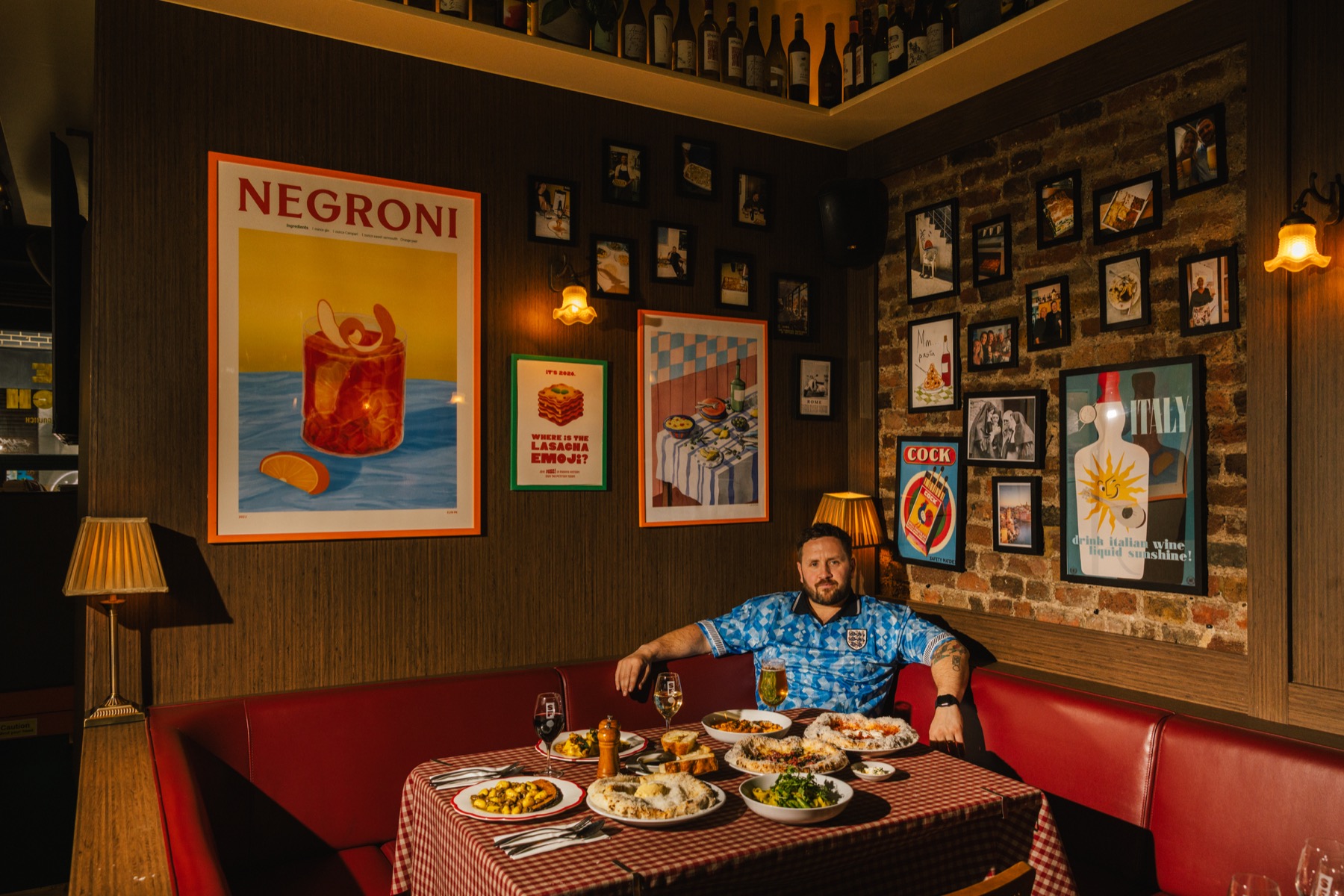 The founder of Out of Hand Hospitality at a full Senza Fondo table